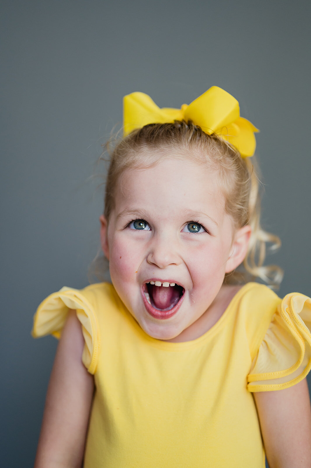 Modern school portrait of a child with soft expression, photographed in the Hudson Valley