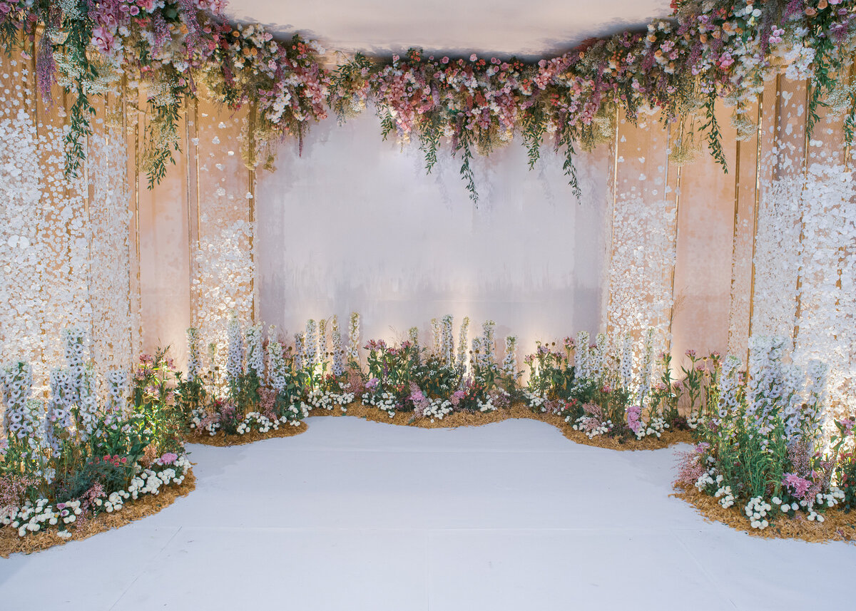 A luxury wedding ceremony backdrop with flowers for a celebrity party