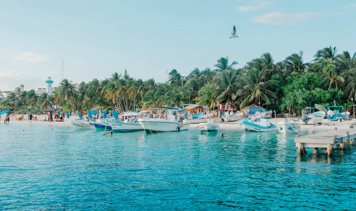tropical waters with boats in Mexico