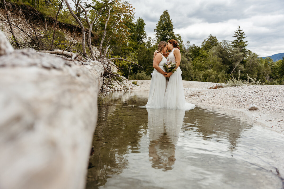 romantic couple in Soča Valley river elopement