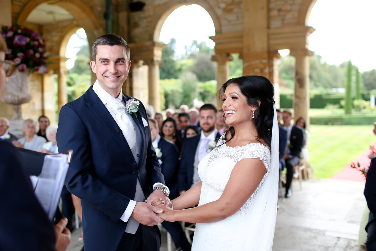 bride-and-groom-saying-vows-at-luxury-wedding-in-kent