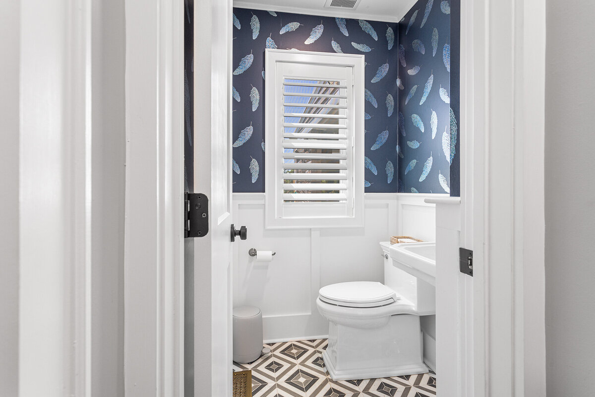 powder bath with blue wallpaper