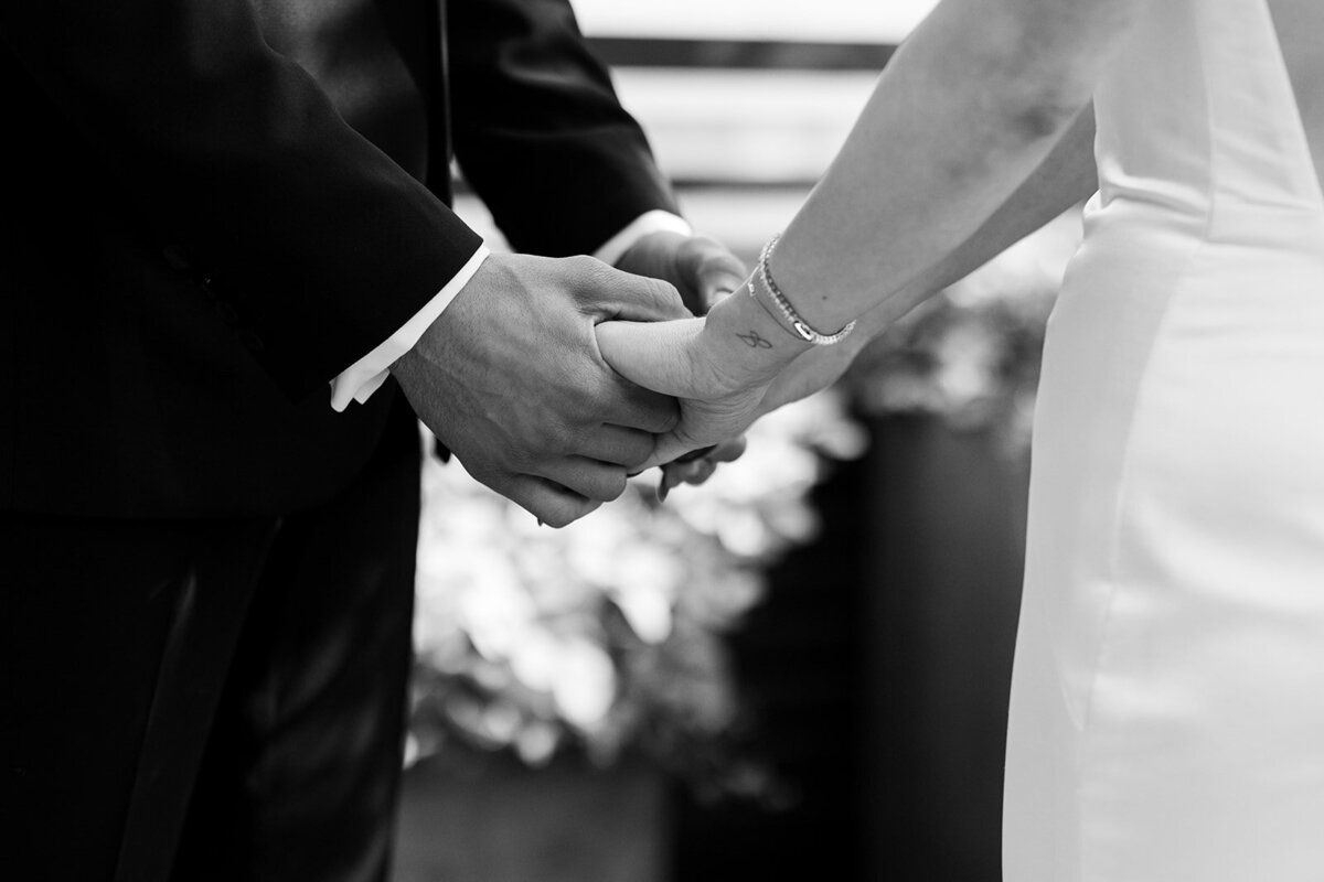 Elopement ceremony hand holding hand tattoo bride and groom moody edgy soho
