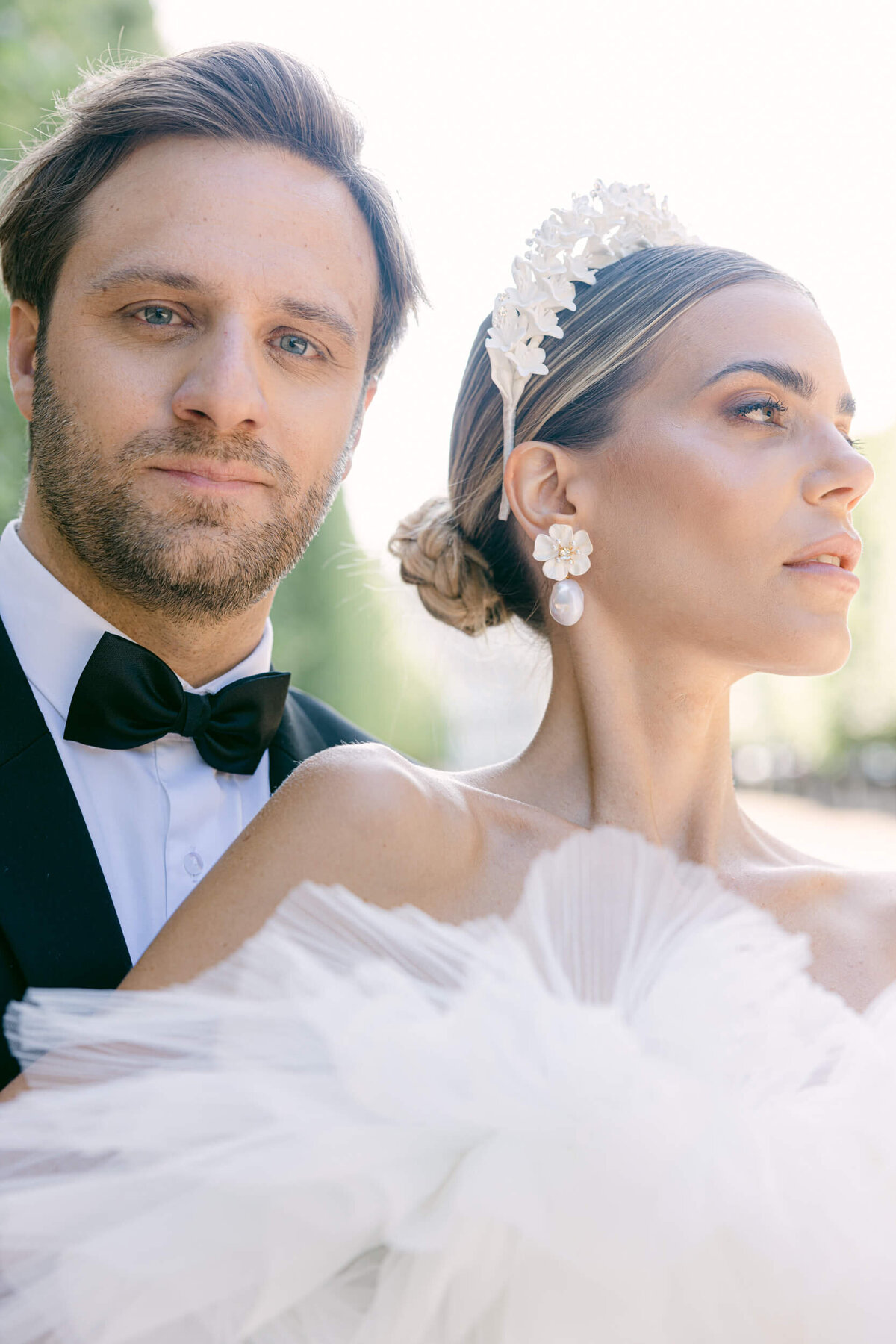 A wedding photo of a bride in her white dress in the streets of Paris in France.