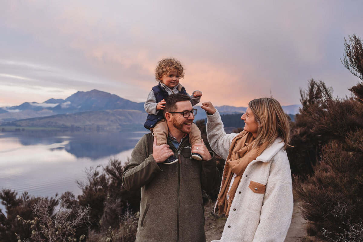 family standing at the lake during a wanaka family photography session captured by Bie