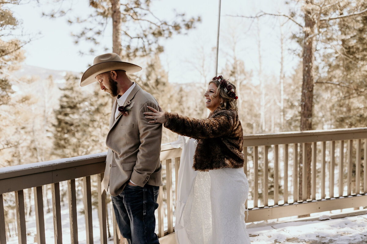 bride walking up behind her groom to see each other for the first time