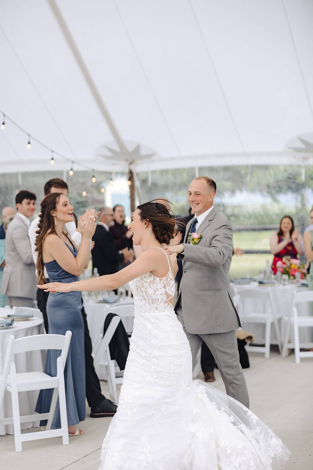 Bride and groom walking into wedding reception at Finger Lakes, NY