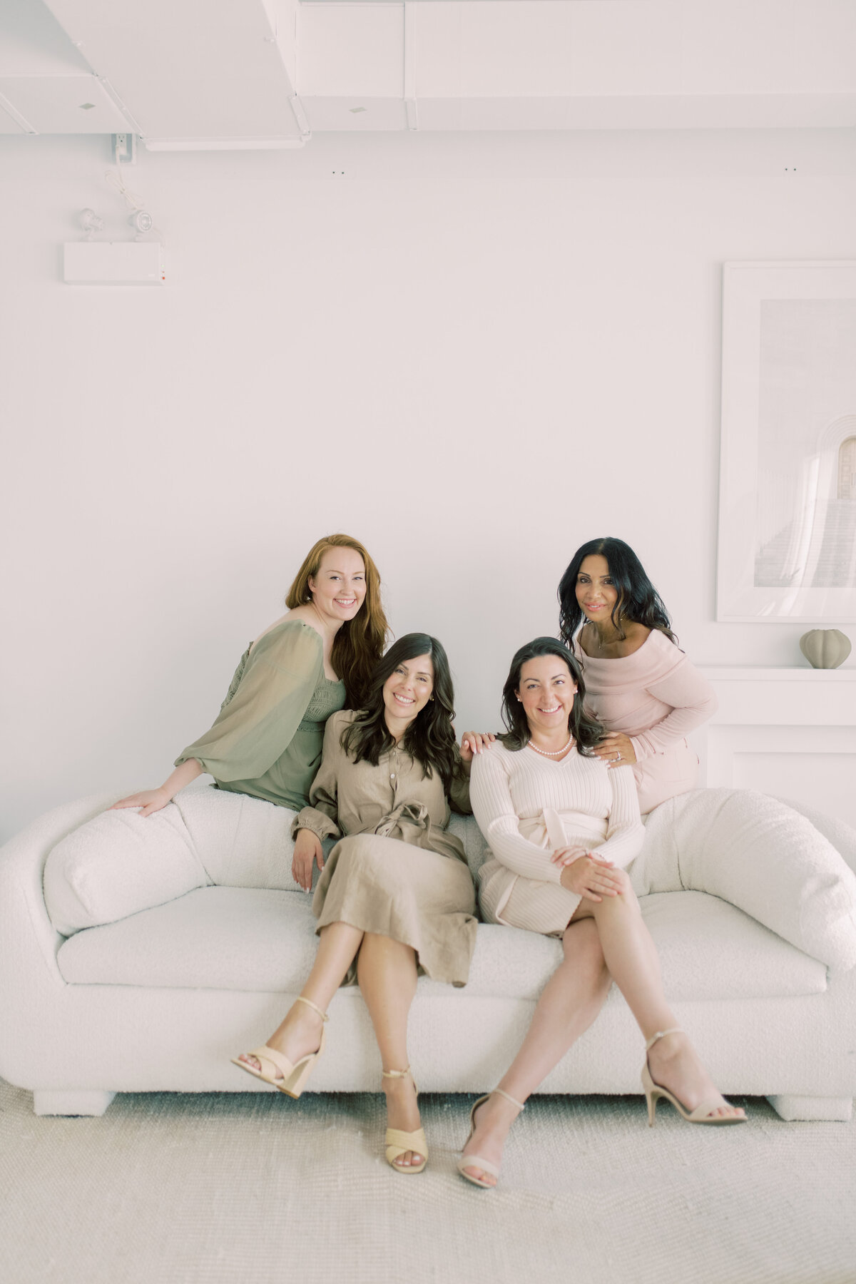 Team portrait on couch smiling