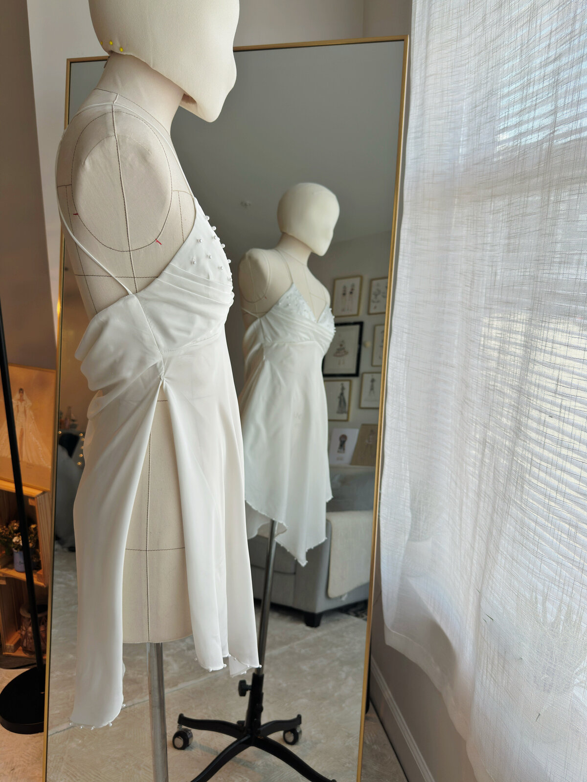 Effortless ivory slip gown designed with feminine silhouette
