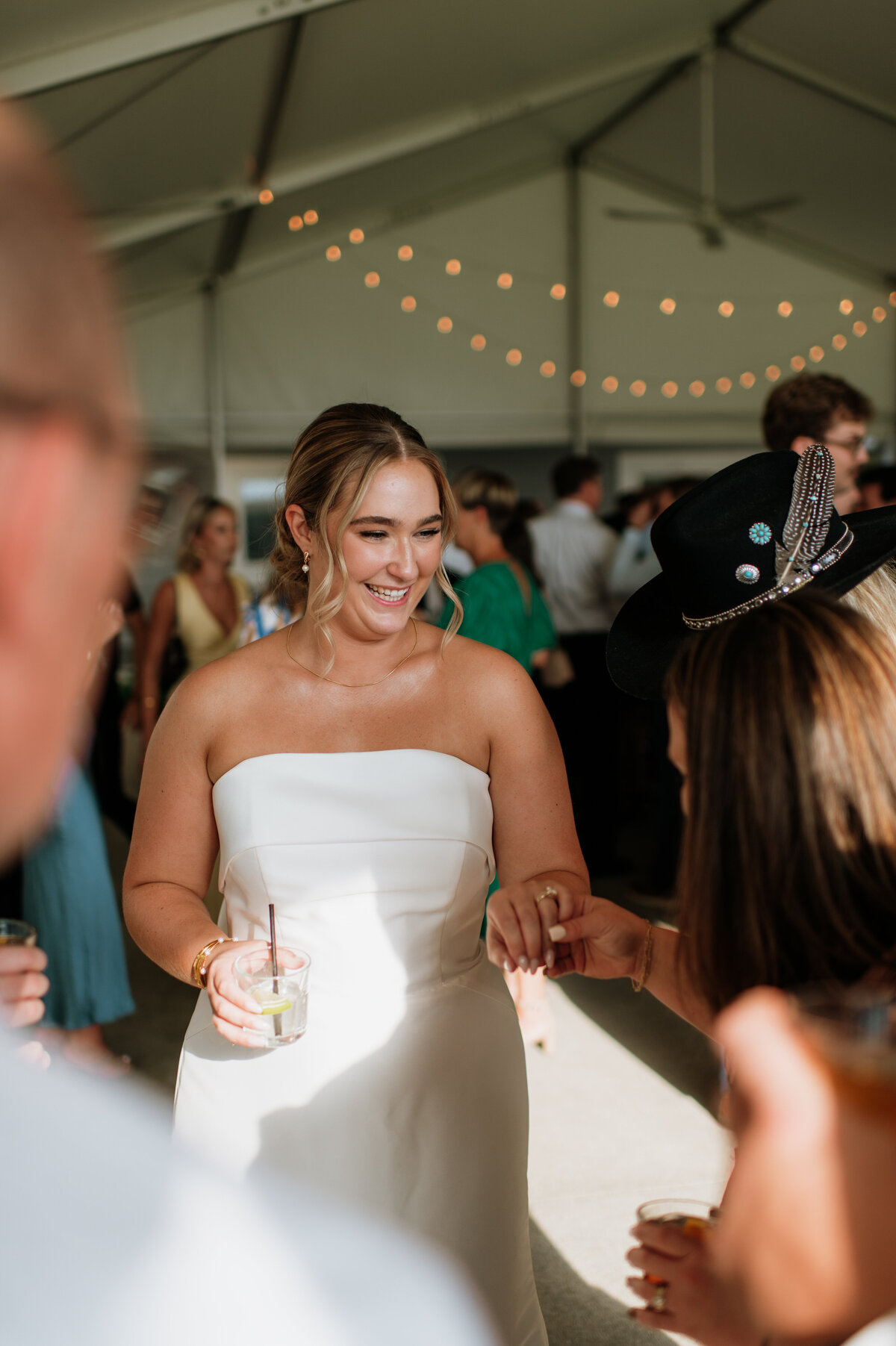 Bride laughing on dance floor at reception