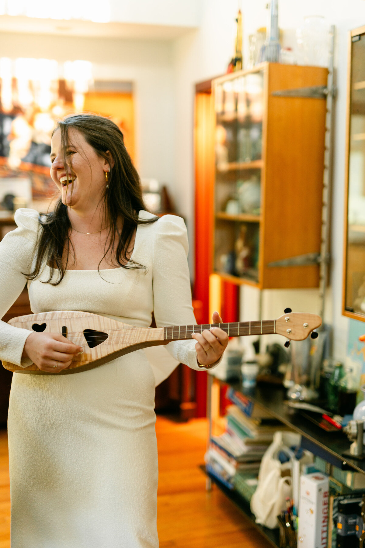 Bride smiling while playing an instrument