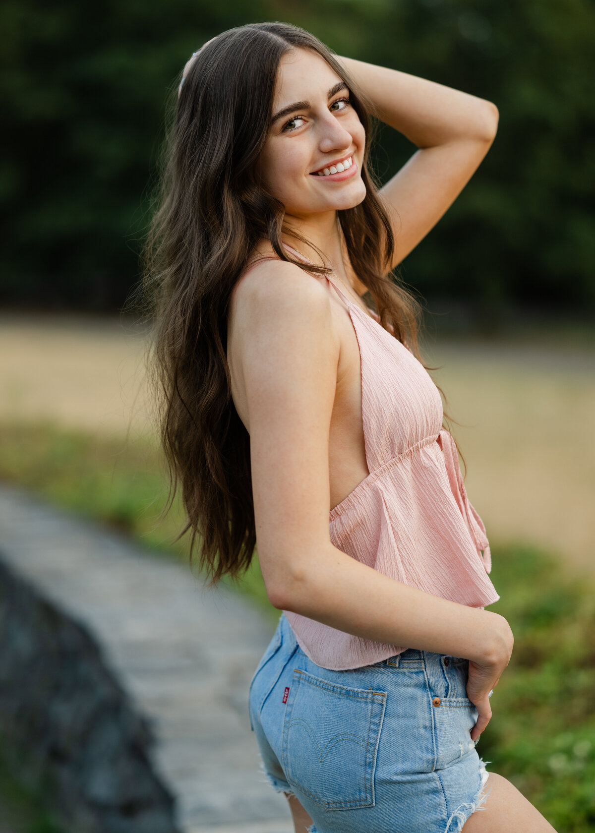 rock wall senior portrait jean shorts and tank top girl