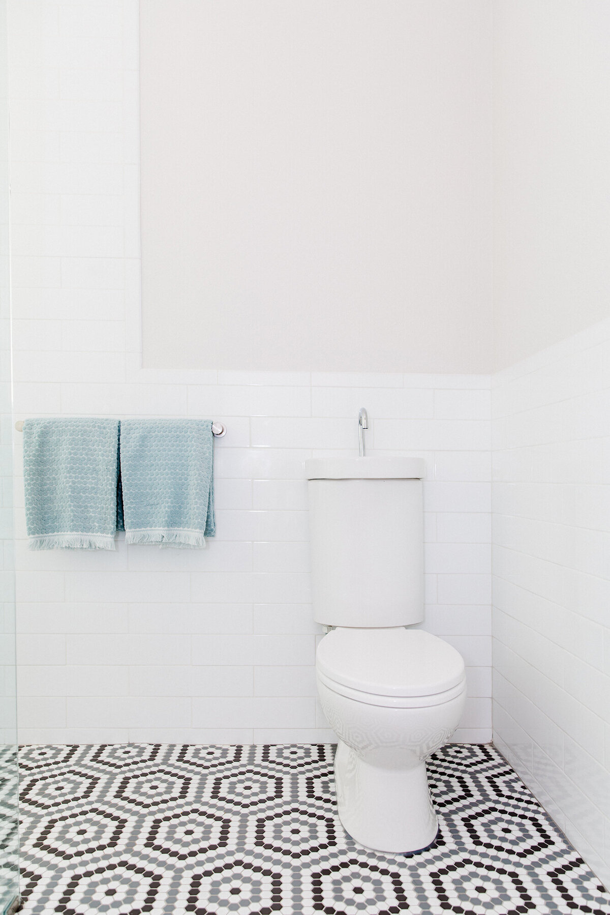 Fresh, modern bathroom remodel with hex tile floor - desi