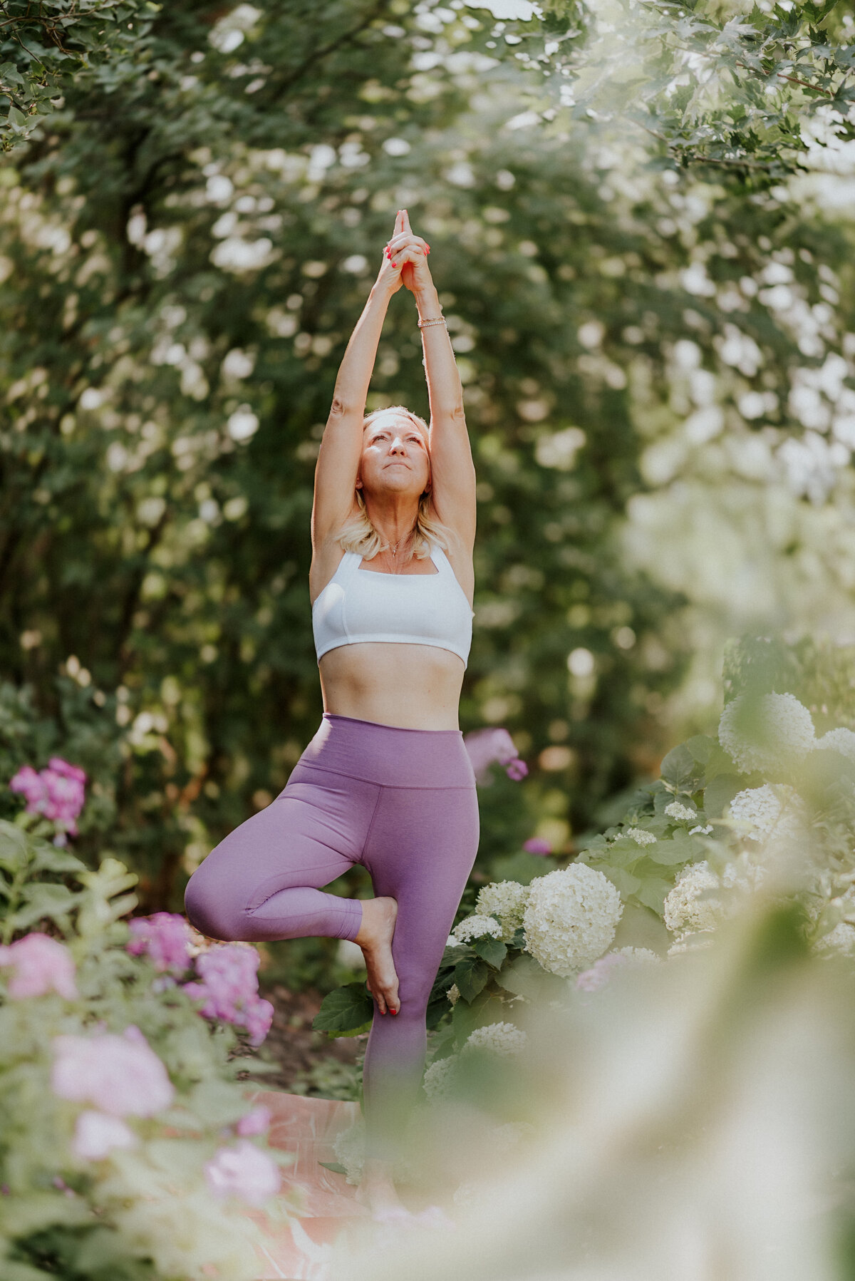 Peaceful portrait of Amy Witte seated in a grounding yoga pose, showcasing yoga for seniors branding photography.