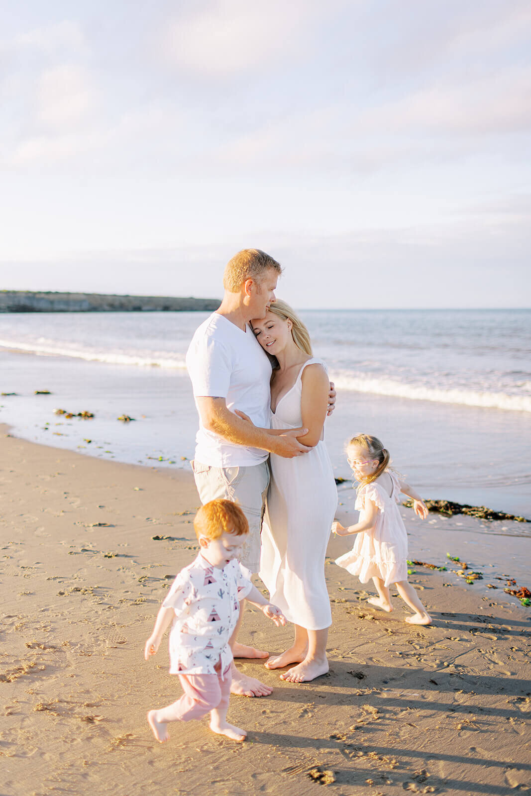 kids-running-around-parents-at-the-beach