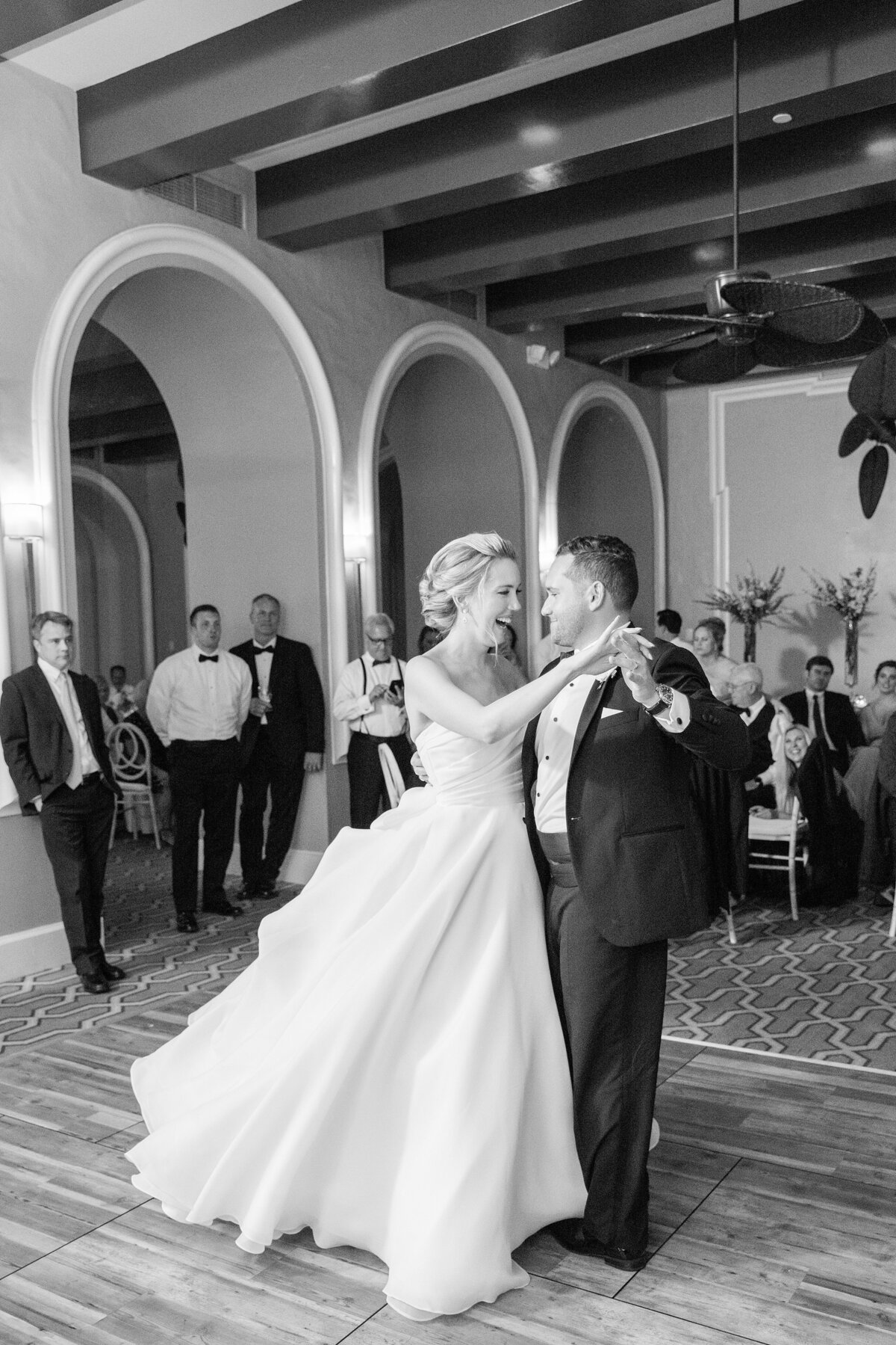 black and white photo of bride + groom during their first dance