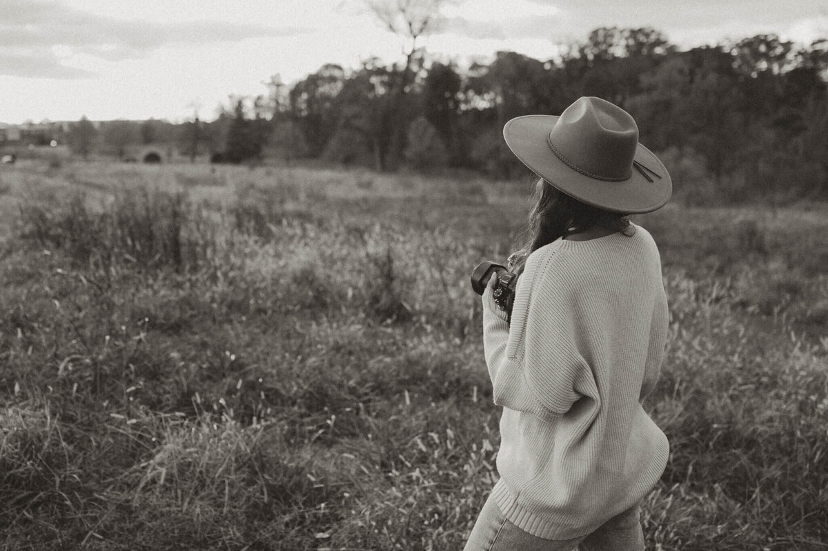 Photographer Tonya Cassibry looking out at a peaceful field near Charlotte, NC—the perfect spot for family photos.