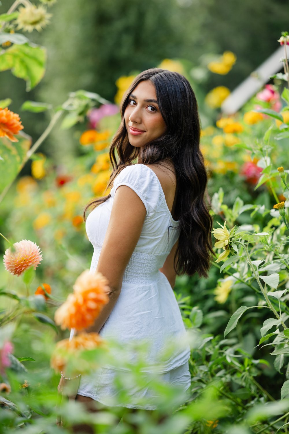 bellevue high school senior girl in white dress at dahlia farm