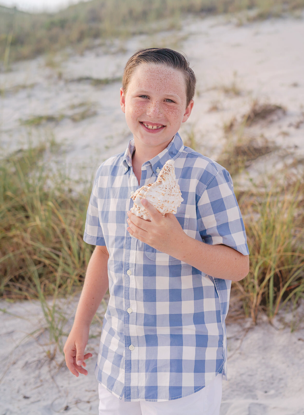 boy-with-seashell-navarre-beach