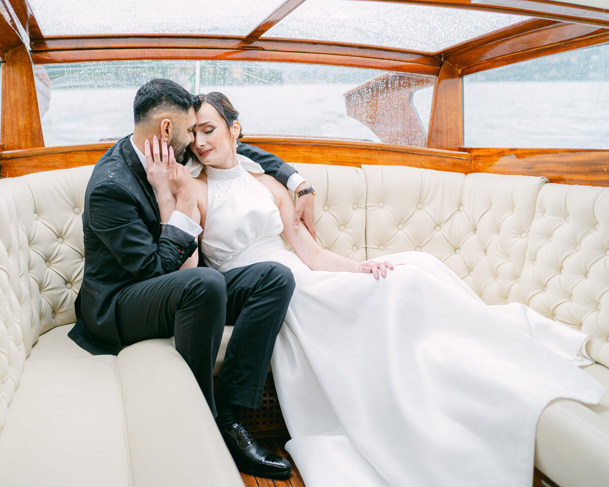 Intimate moment with bride and groom on a private boat on Lake Como