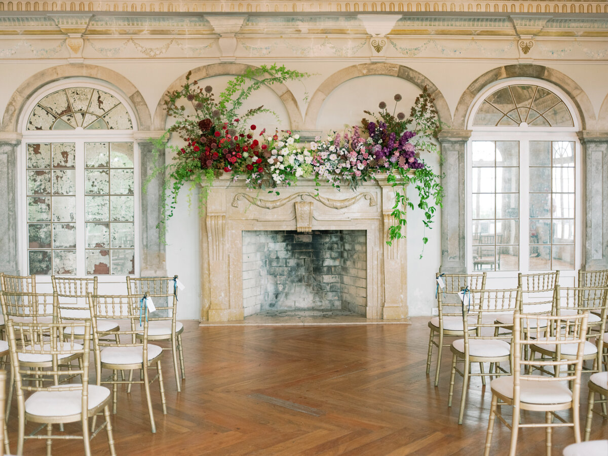 casa-dos-penedos-portugal-wedding-indoor-ceremony-fireplace-flowers