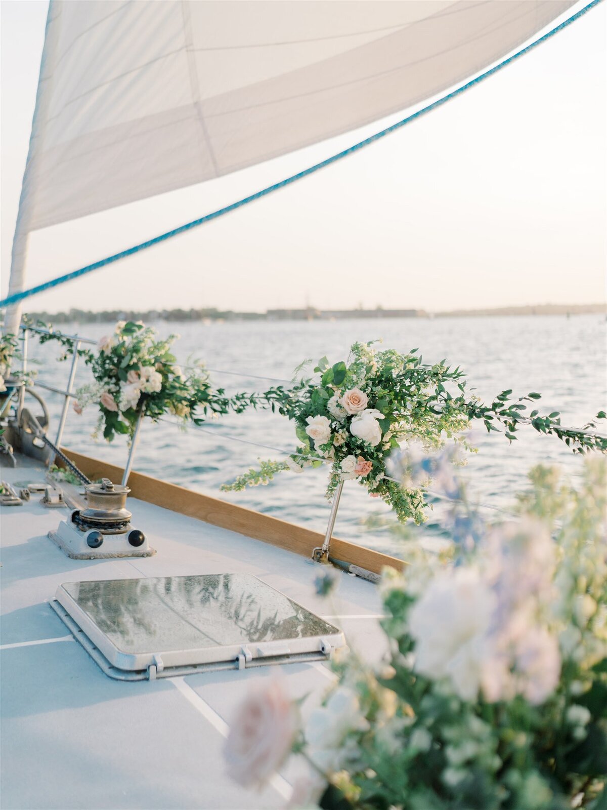 Kate-Murtaugh-Events-RI-wedding-planner-coastal-Newport-luxury-elopement-floral-installation-sailboat-yacht-sail-RI-greenery-bow
