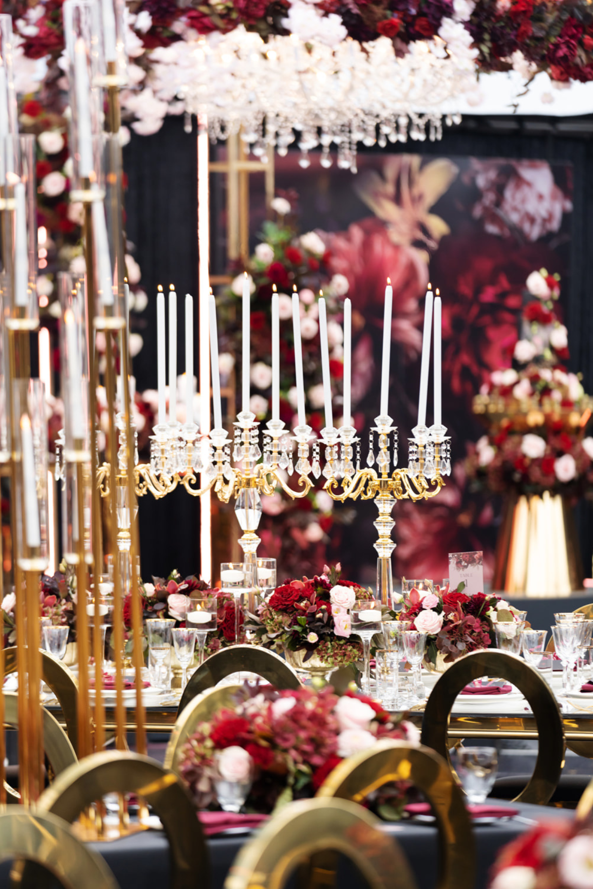 black-gold-burgundy-red-tent-reception-chandeliers-roses-candelabras-chair-candles