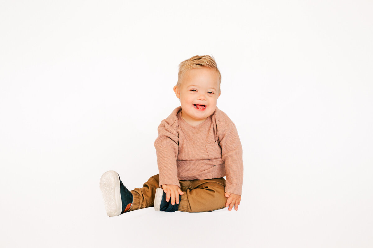 toddler boy laughing captured by Springfield MO kids photographer 