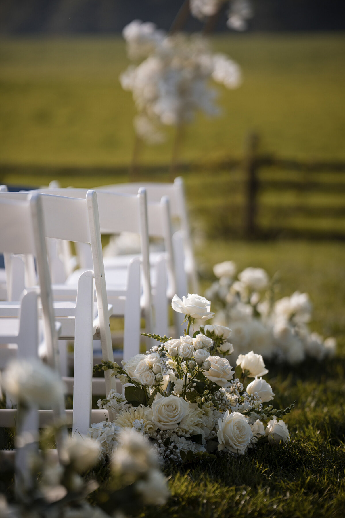 All white ceremony decor at a destination wedding in Vermont
