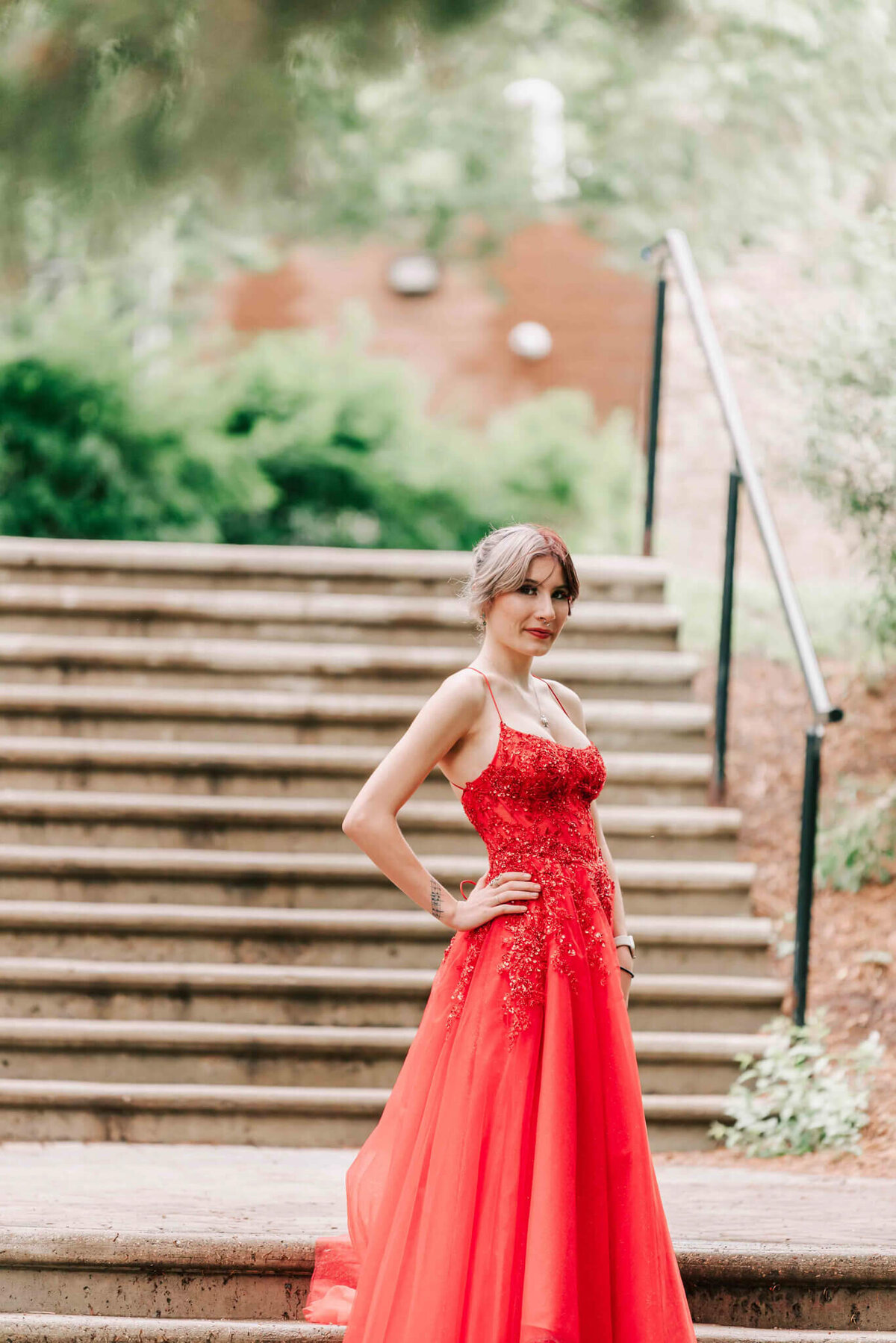 Standing by some stairs. 