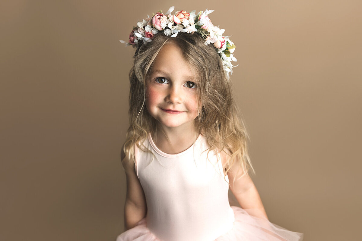 Sweet little girl in Colorado wearing a flower crown for her picture