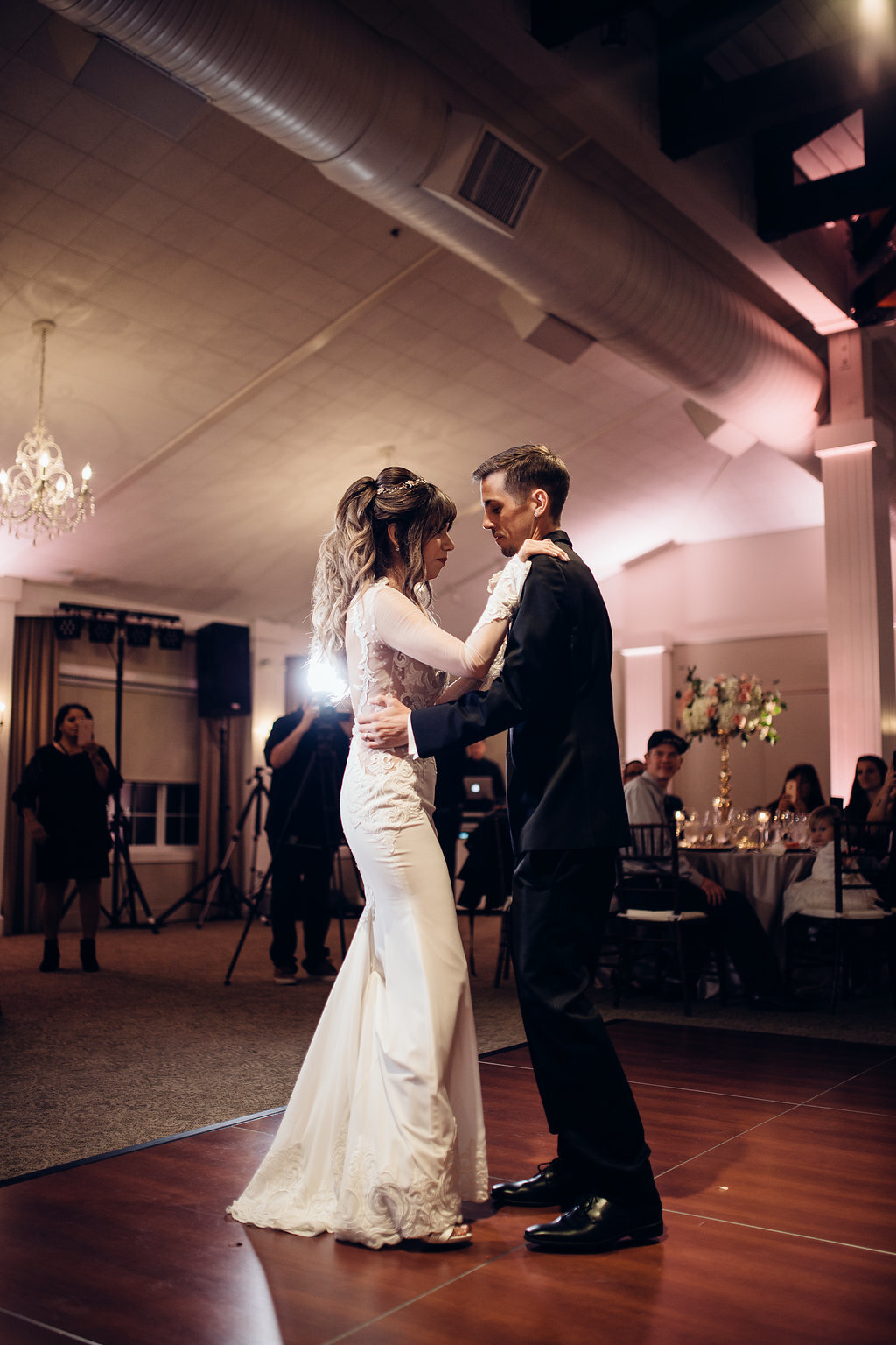 Wedding Photograph Of Bride In White Dress And Groom In Black Suit Dancing Los Angeles