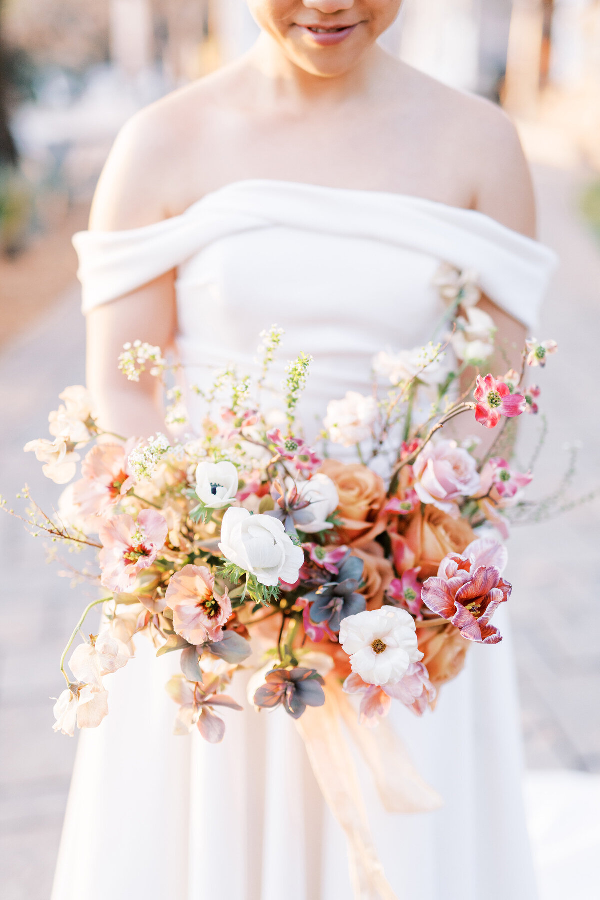 golden hour photos of bride with bridal bouquet of spring flowers at napa valley calistoga venue