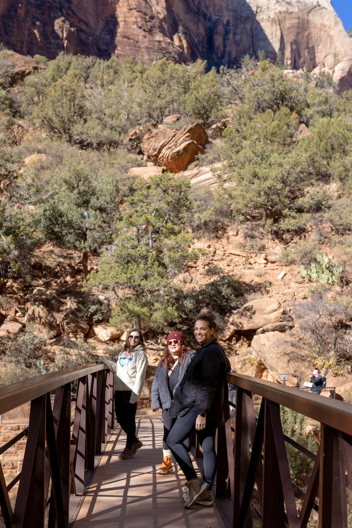 group of women standing on bridge