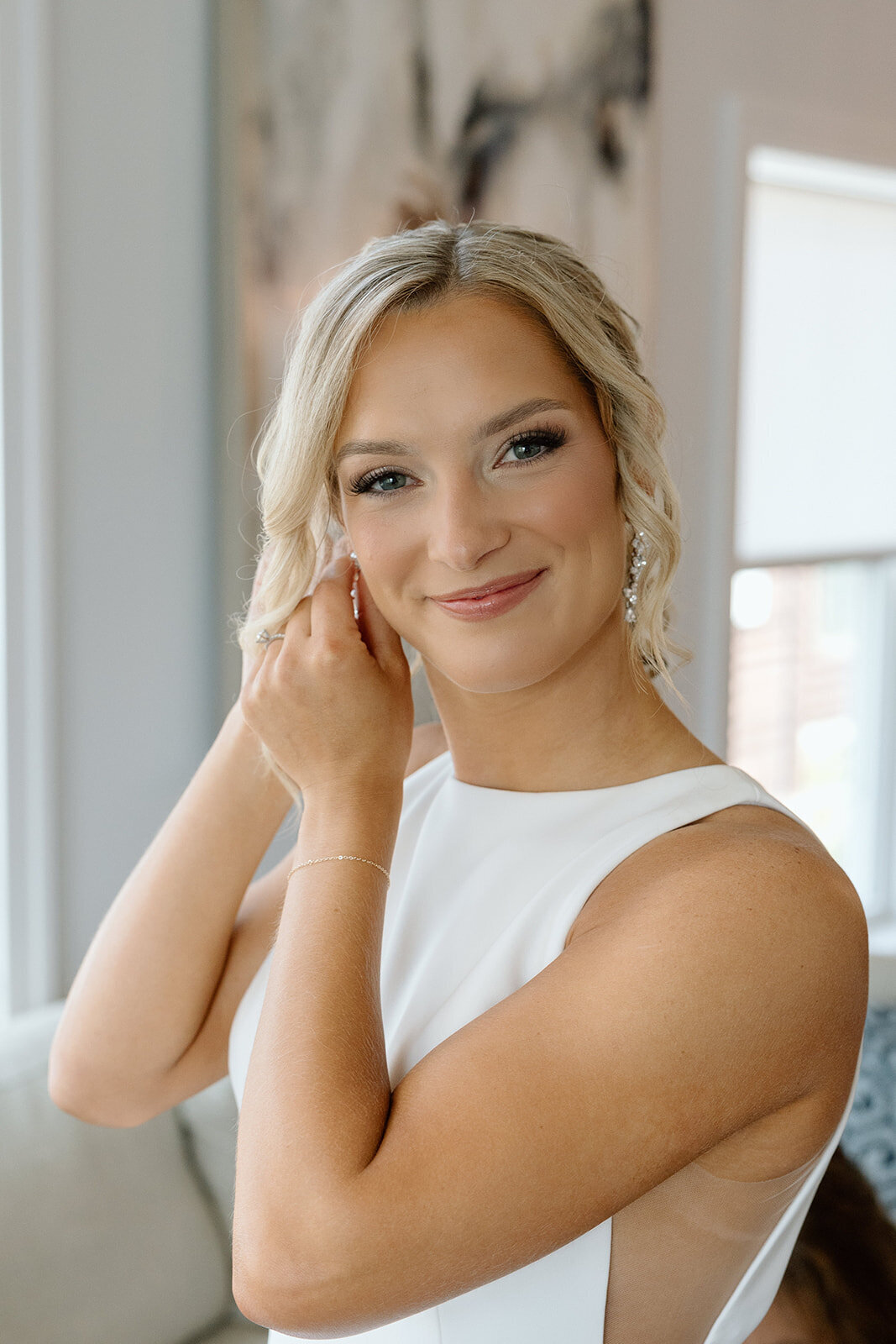 Bride with soft curls and natural bridal makeup in Rockford, IL. Wedding hair and makeup services.