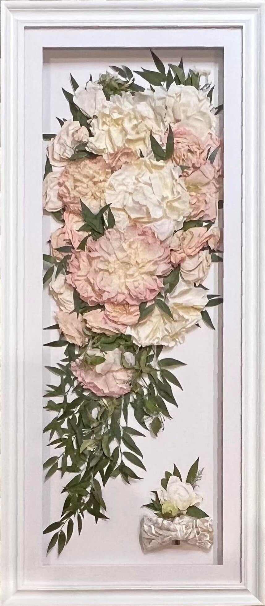 pressed wedding florals inside custom frame.
