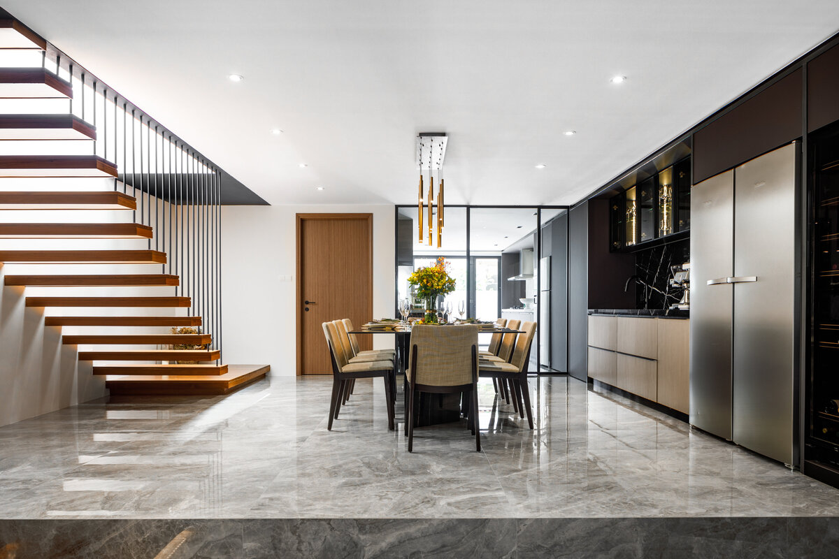 reflective staircase and dining area