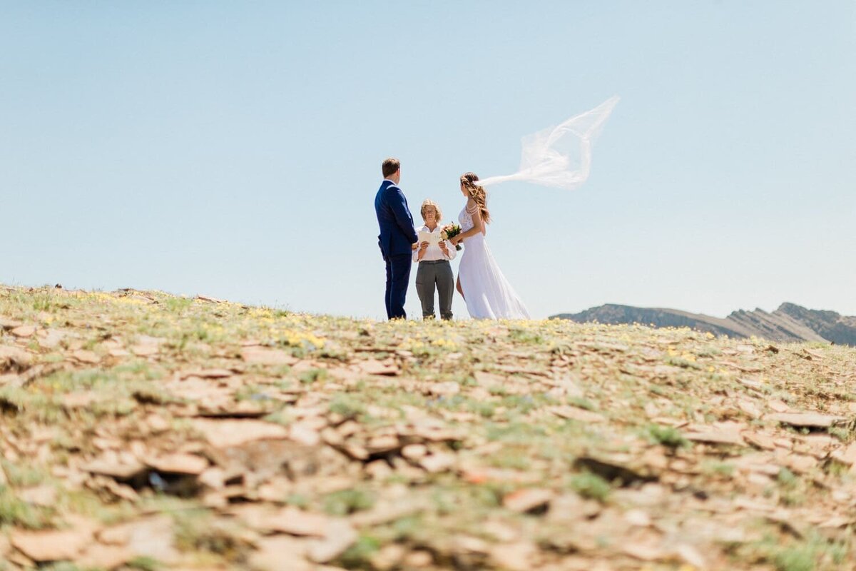 Far-away-photographs-of-a-couples-ceremony-during-their-mountain-helicopter-elopement