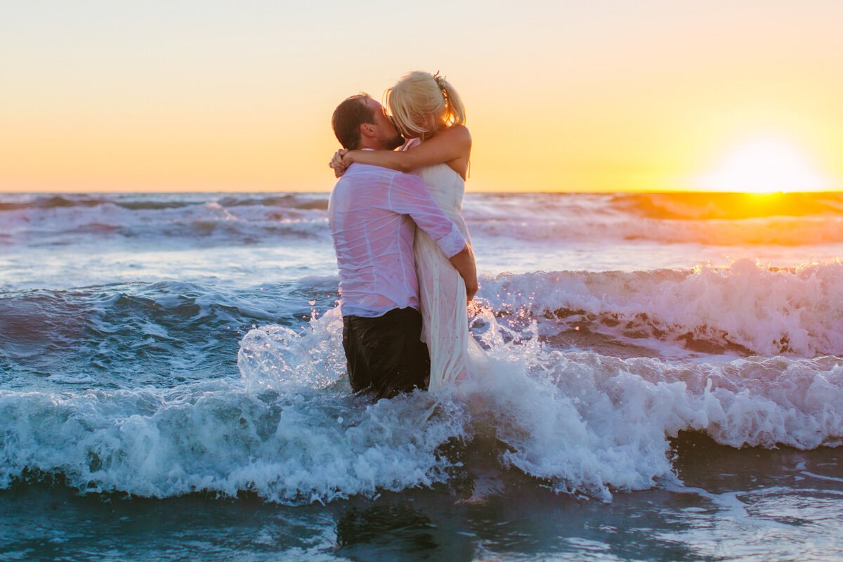 couple kissing in ocean