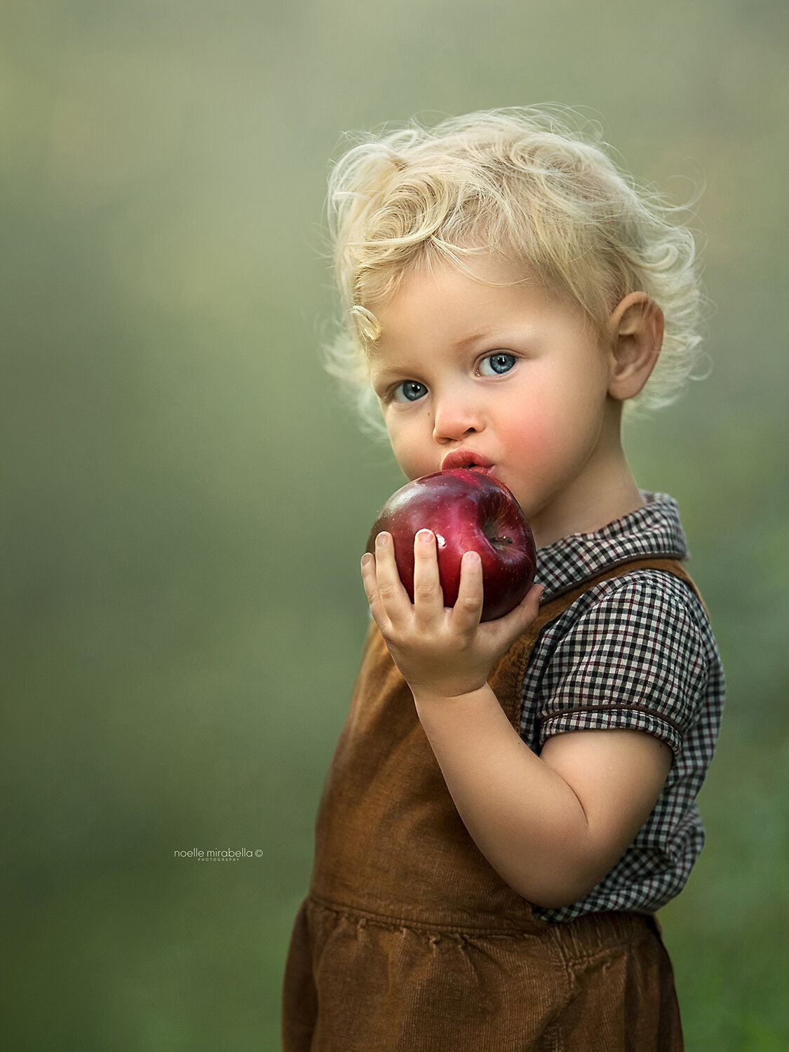 Child Eating Apple Outside
