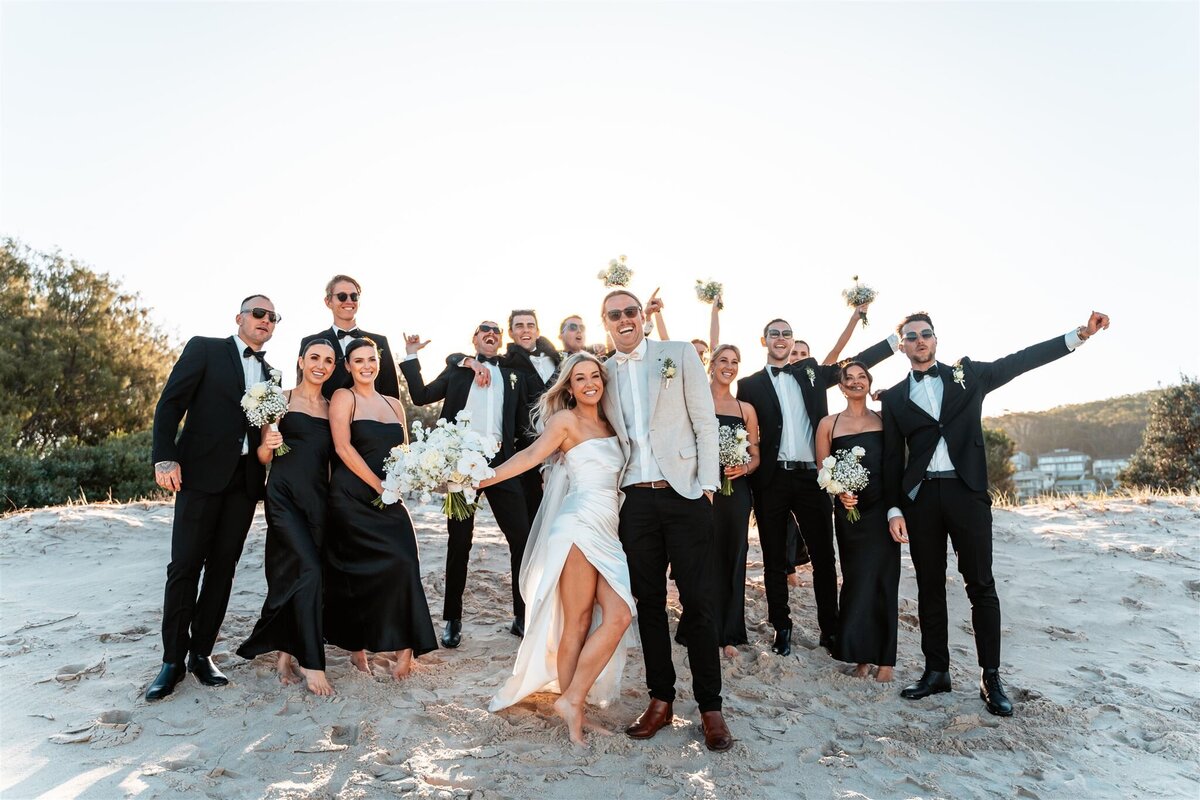 Michaela & Luke together with the bridesmaids and groomsmen having a fun after wedding photo shoot!