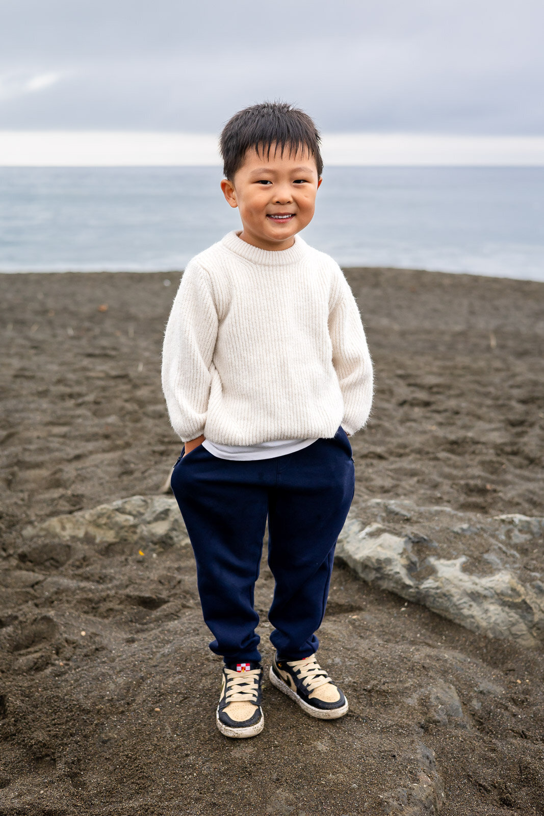 Smiling boy standing on the beach during Bay Area school photography lifestyle session – Ellobelle Photography