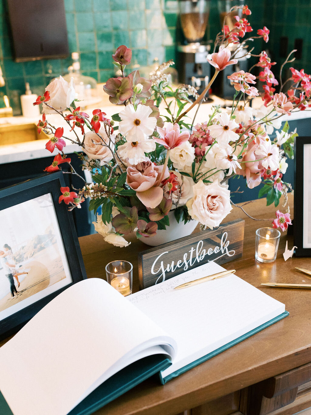 luxury statement wedding flowers for the welcome table in dusty rose and mauve