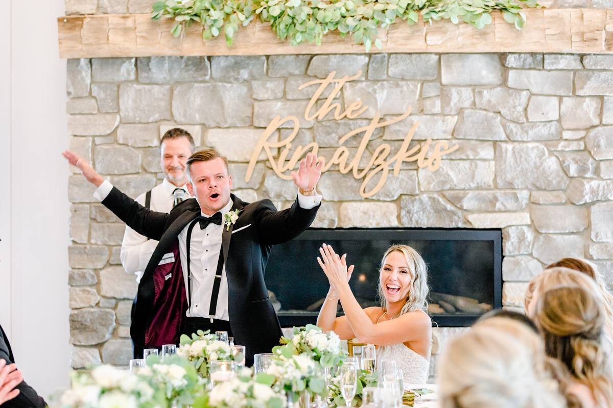 father of bride has a fun speech and groom and bride react