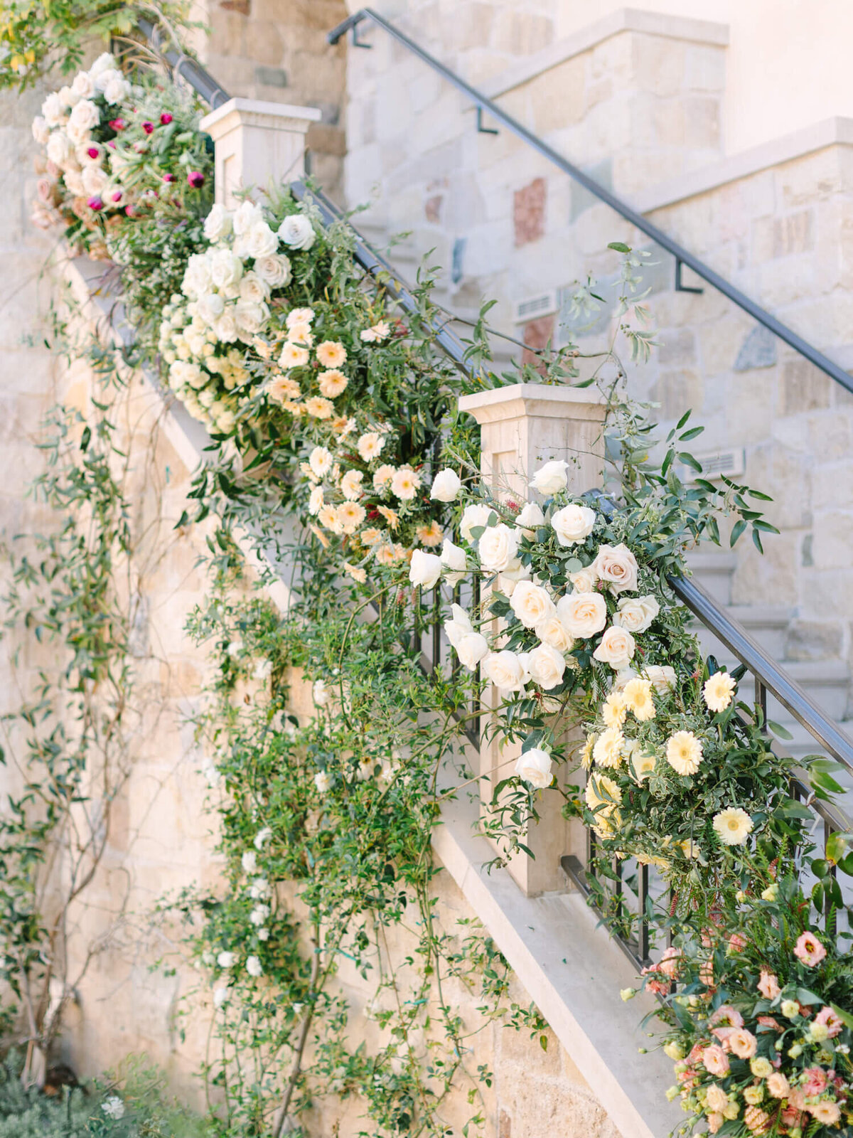 wedding flowers roses lining the stairwell at Monserate winery
