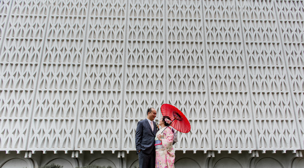 Couple getting their wedding portraits done during their Musuem of Vancouver wedding