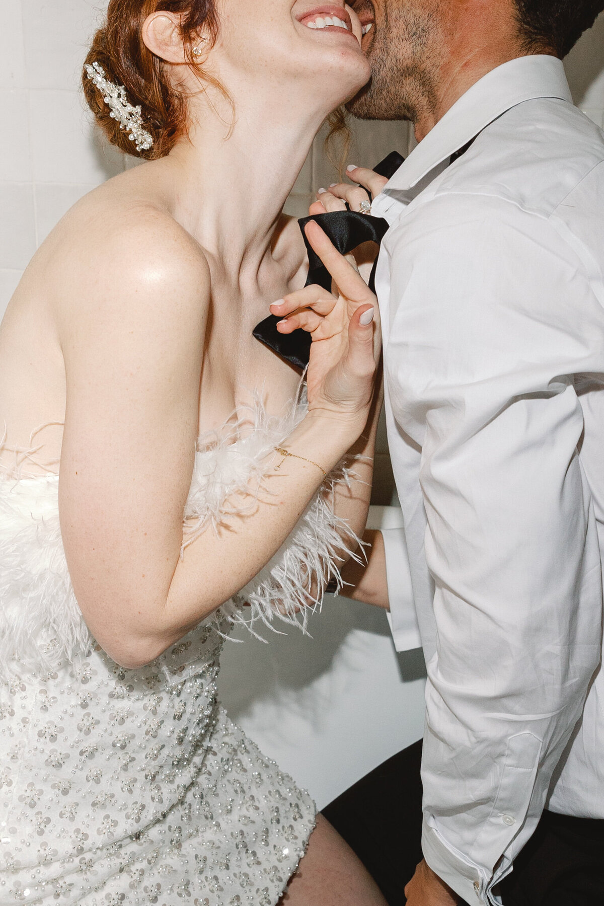 intimate flash photo of bride and groom during reception