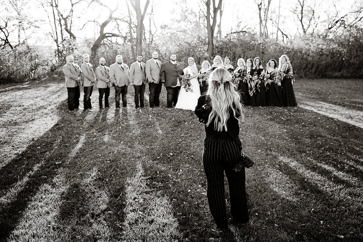 Tara taking a photo of wedding party outdoor Ohio