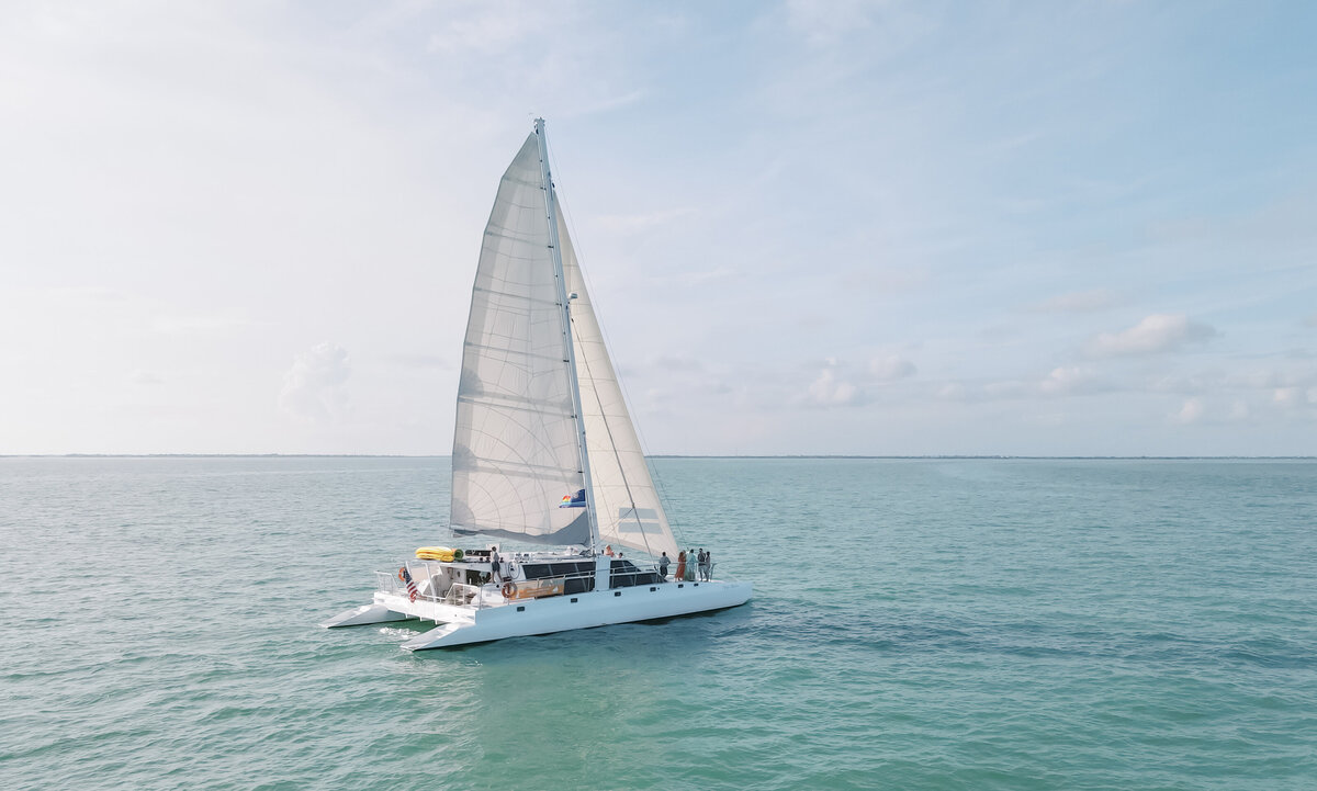 A wedding couple and their guests kick off the weekend with a sunset sail in the Florida Keys