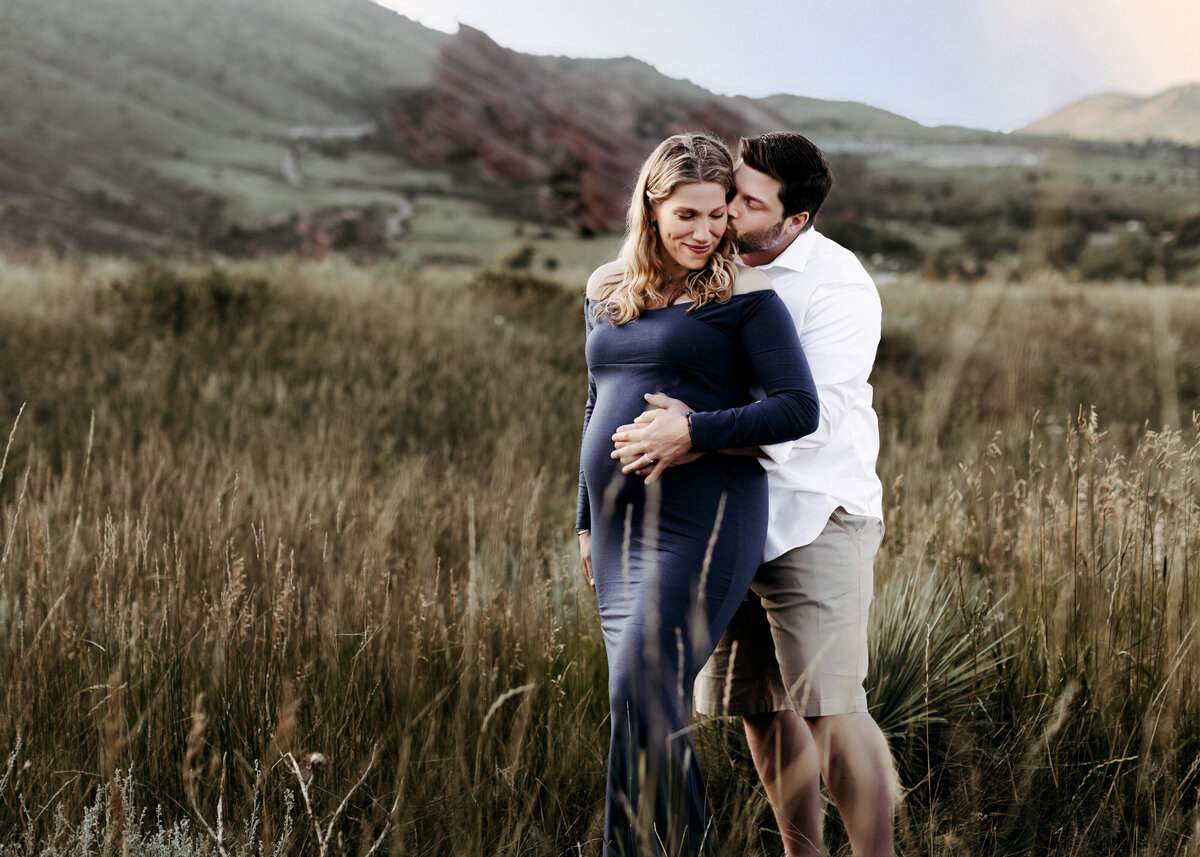 Red Rocks couples pregnancy photoshoot at sunset in the summer